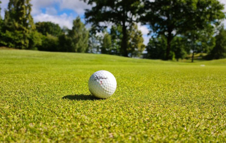 Golf ball in the middle of a green