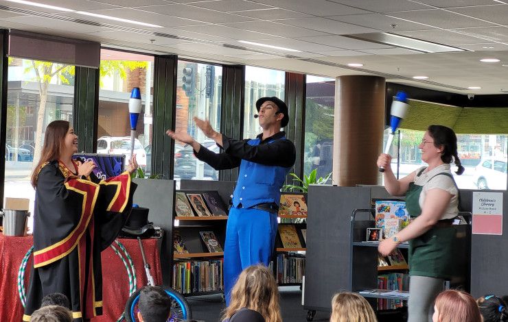 Children looking at a show in the library