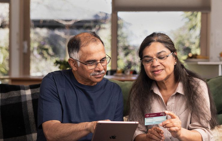 Two people looking at a digital device