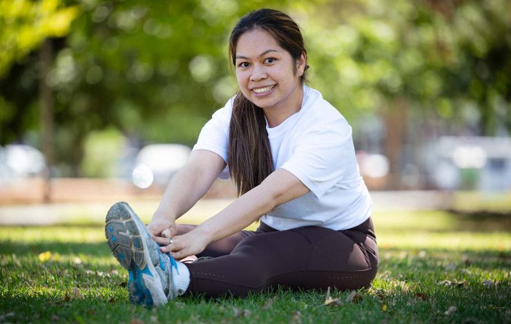 Councillor Melinda Yim exercising in a park