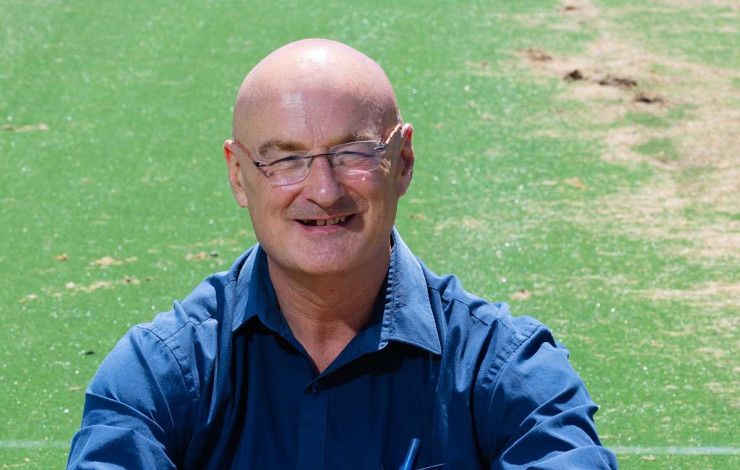 Cr Sean O'Reilly sitting on grass