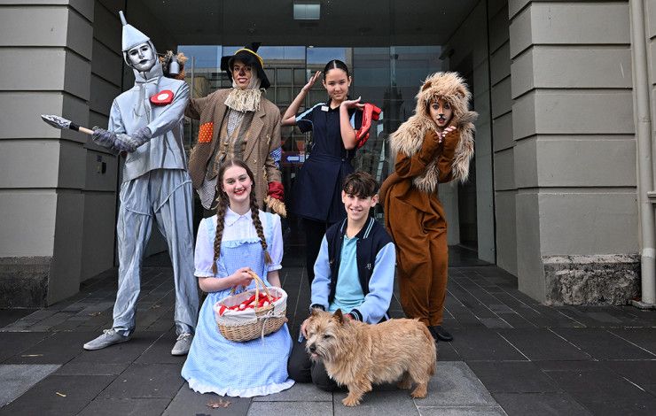 People dressed as Wizard of Oz costumes in front of the Drum Theatre