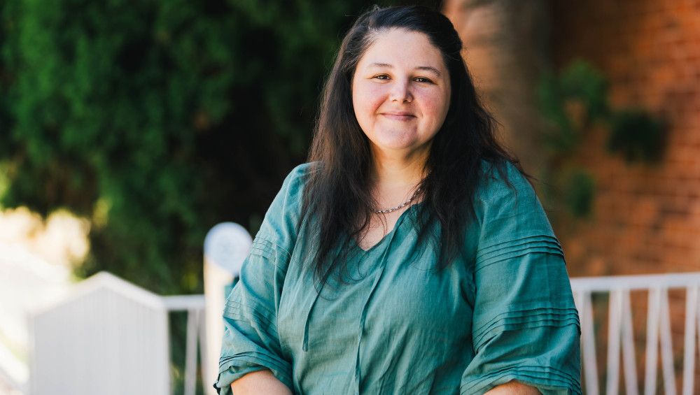 Amanda Meehan - woman in teal shirt