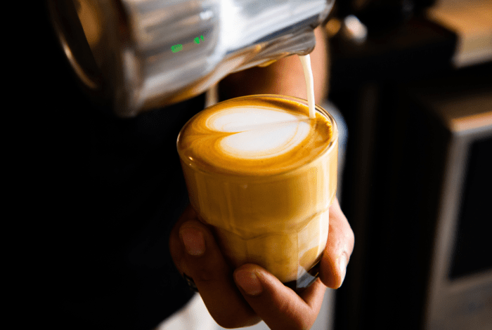 Cup of coffee being poured