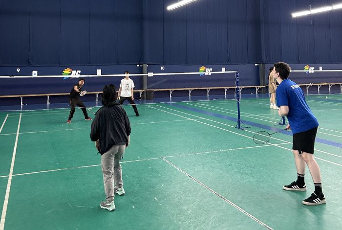 young people playing badminton