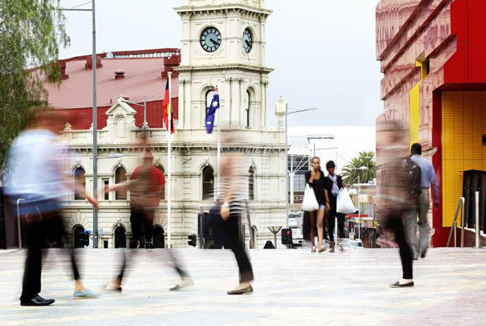 Blurred photograph of people in Harmony Square.