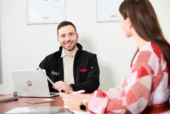 two collegues meeting at desk