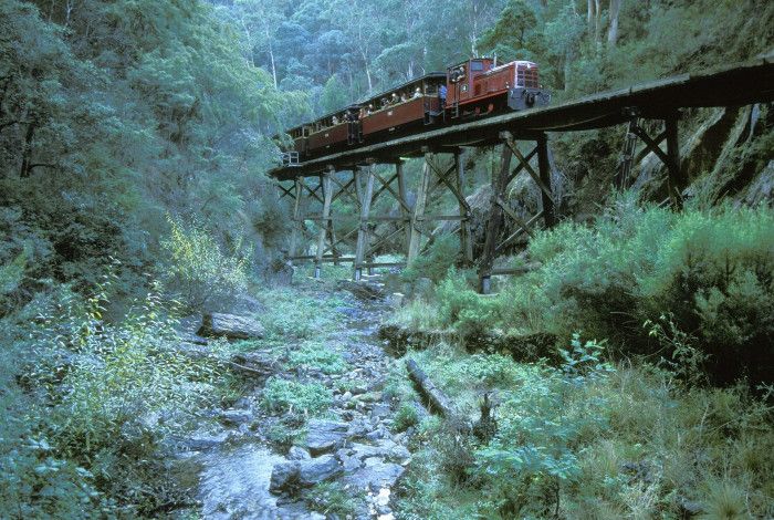 train going across a trestle bridge 