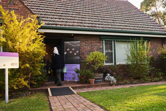 Heritage Hill outside Benga and a person walking inside