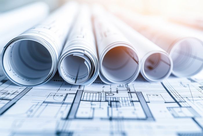 Rolled up plans on table