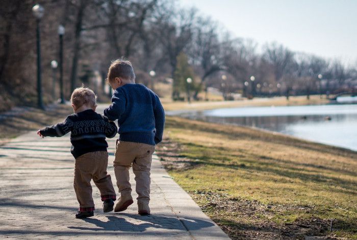 Two children holding hands