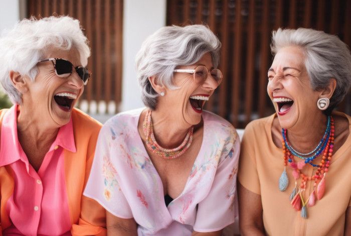 Three women laughing