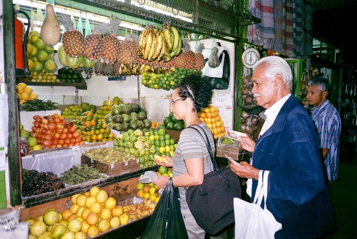 People buying food at a stall