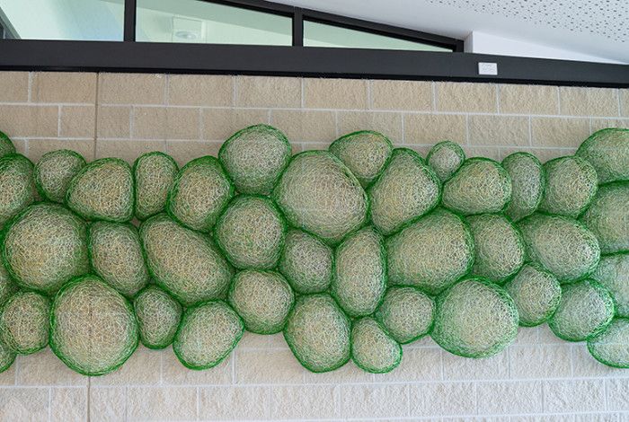 Coalescence artwork green bubbles made from aluminium