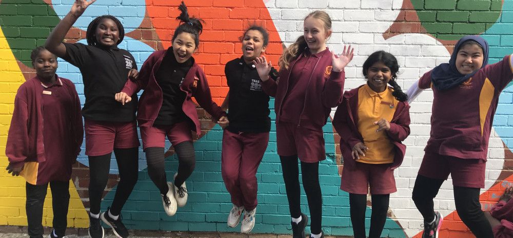 Dandenong West Primary School students in front of public art