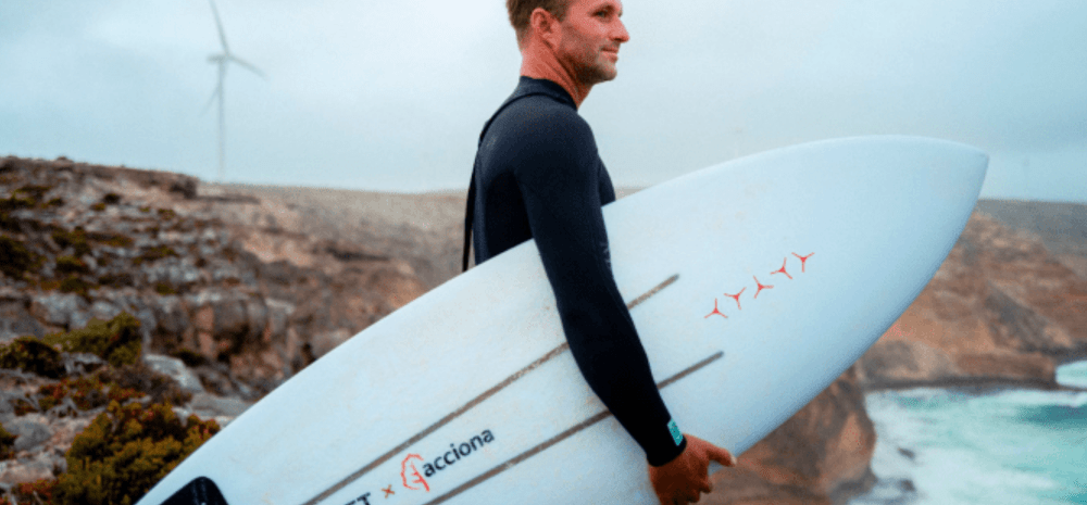 Man holding a surfboard