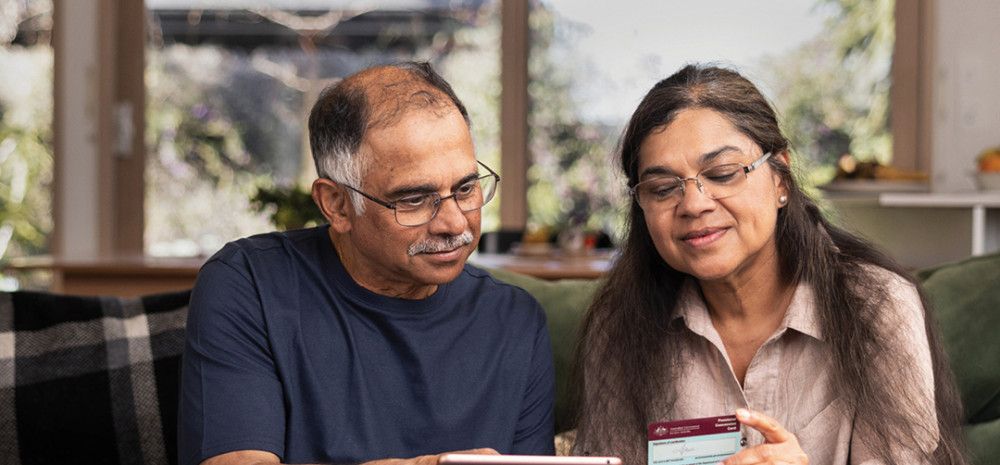 Two people looking at a digital device