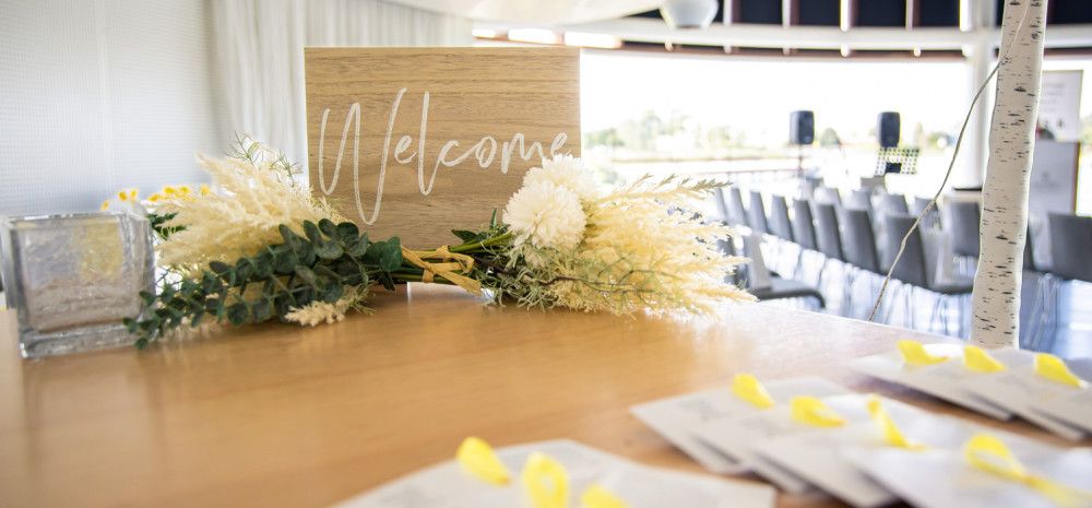 A welcome sign with flowers