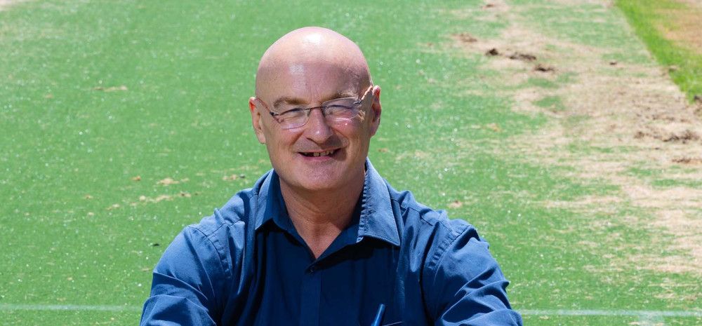 Cr Sean O'Reilly sitting on grass