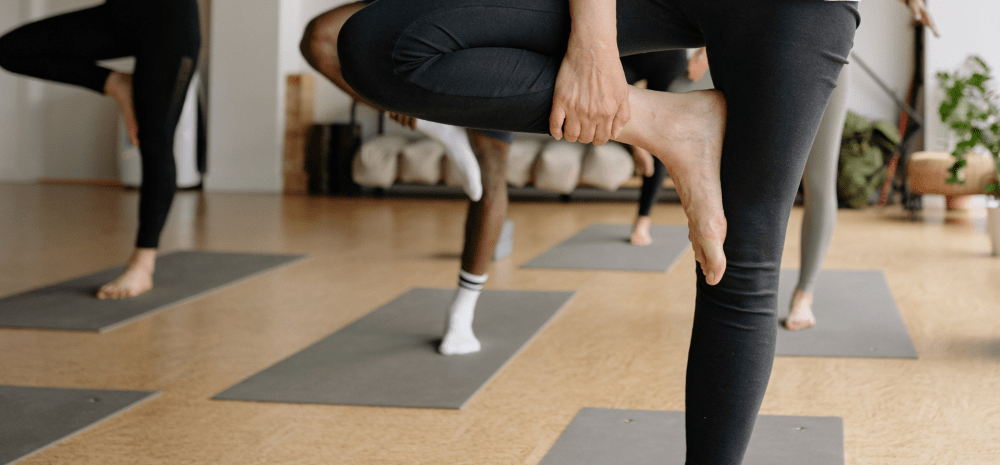 People yoga posing in a studio