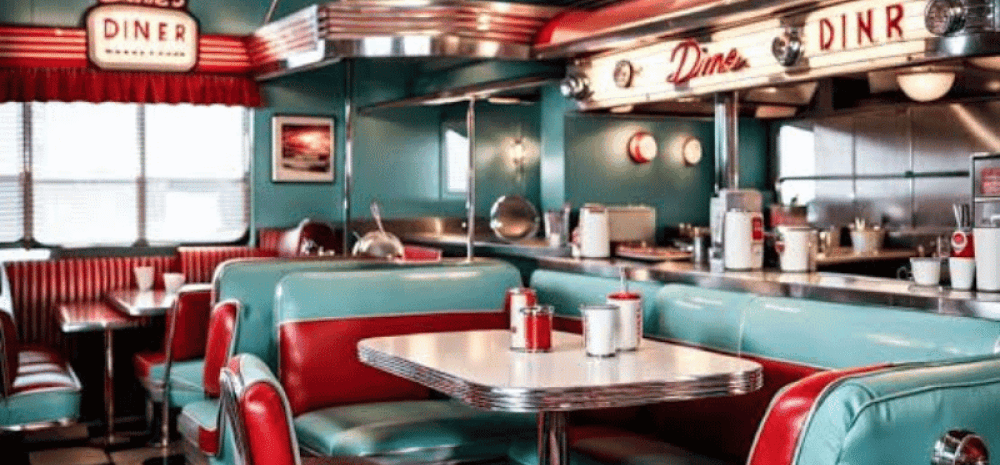 Table, chairs and service counter inside Cafe La Wheels 