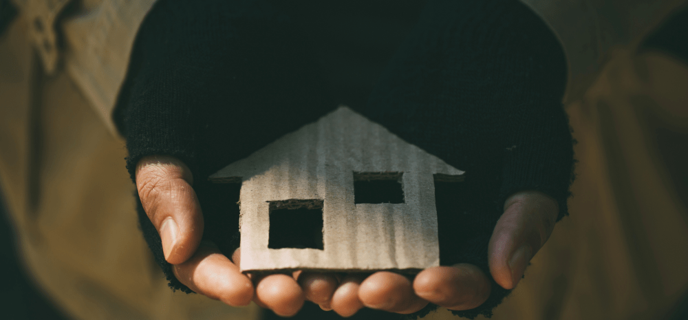 Close up of hands holding a crafted house