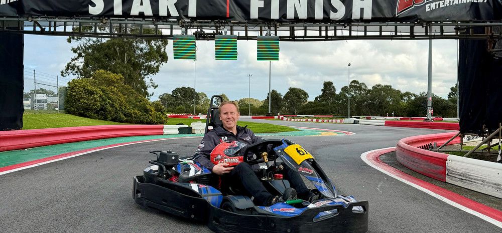 Someone riding a go kart