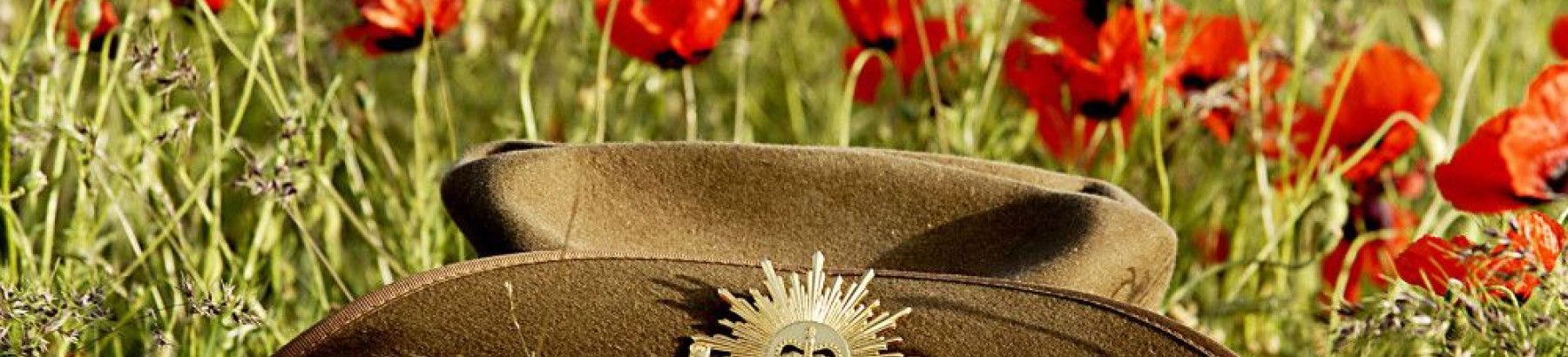 An Army hat in a field of poppies