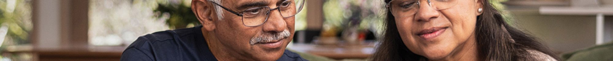 Two people looking at a digital device