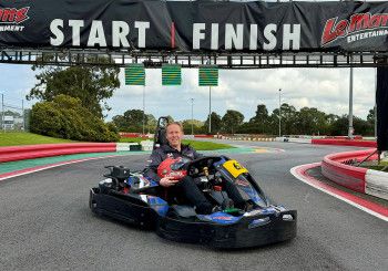 Someone riding a go kart