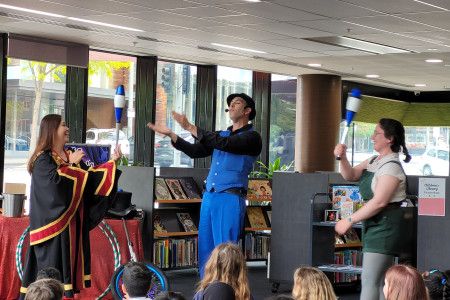 Children looking at a show in the library