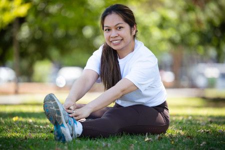 Councillor Melinda Yim exercising in a park