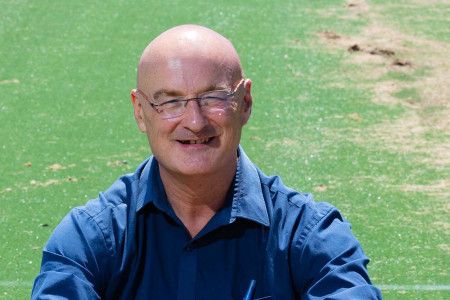 Cr Sean O'Reilly sitting on grass