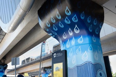 Muderra artwork on a concrete pole